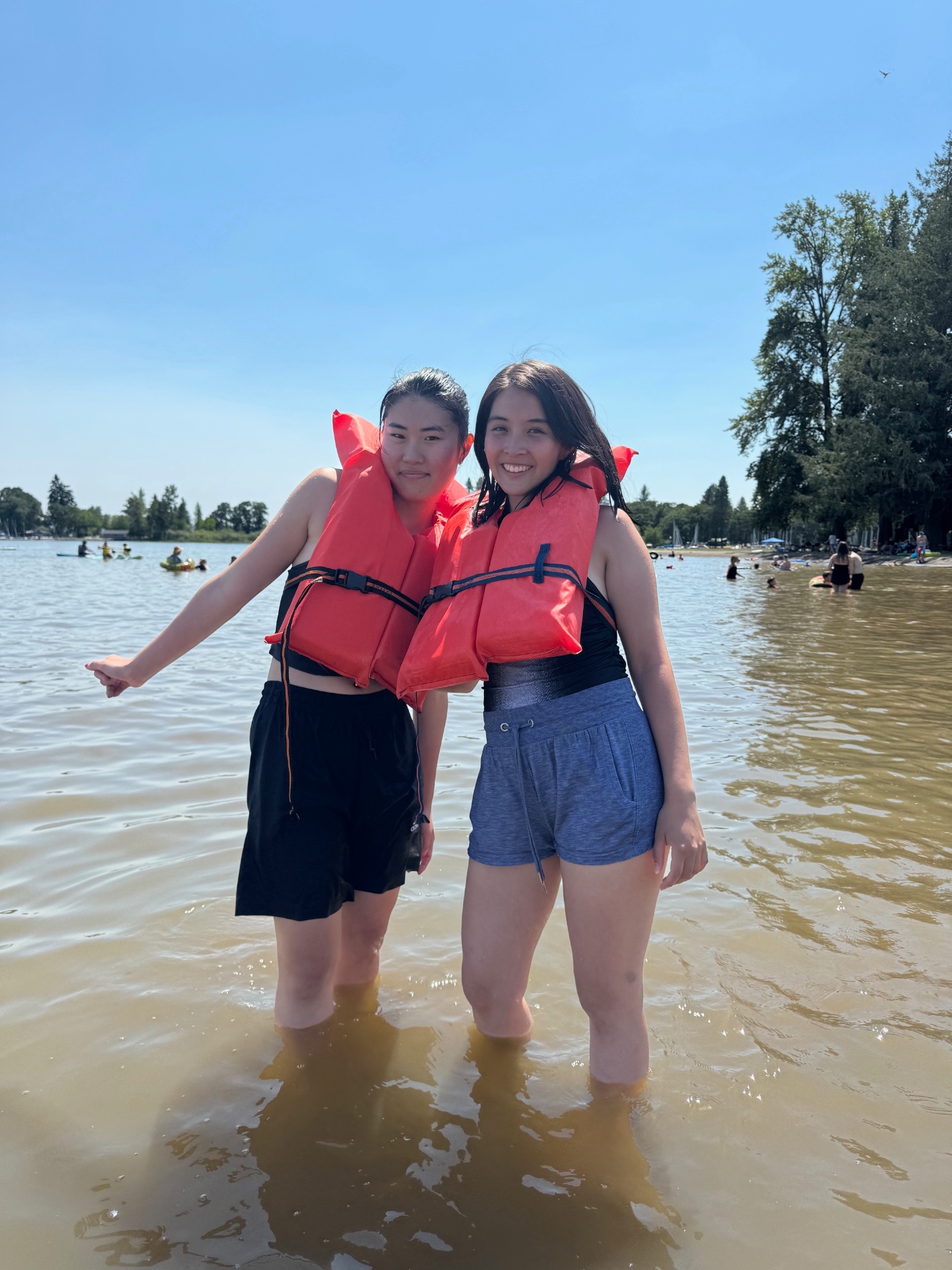 Two Connect friends in life jackets at the lake